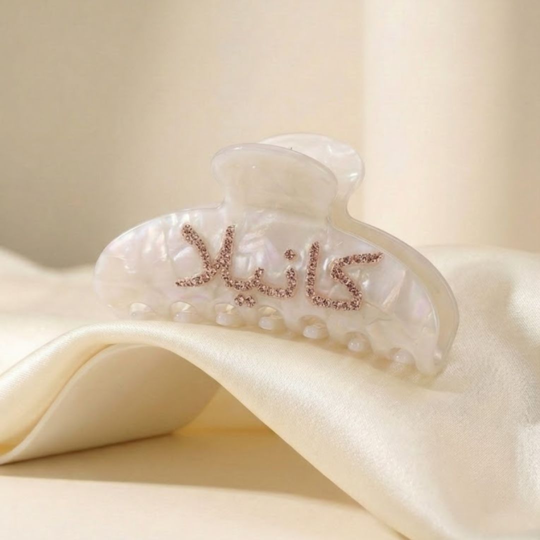 close up of arabic name hair clip hand-set crystals double sided