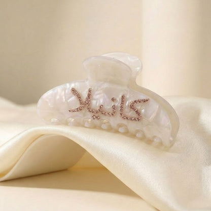 close up of arabic name hair clip hand-set crystals double sided