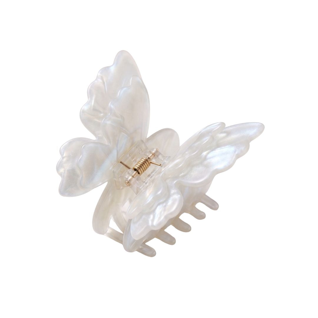 white glass butterfly hair clip flat lay product shot kanella