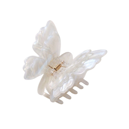 white glass butterfly hair clip flat lay product shot kanella