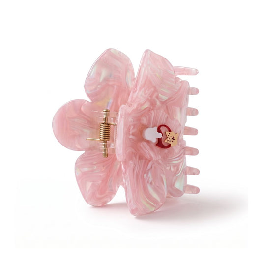 A pink translucent flower-shaped hair claw clip with marbled iridescent swirls and a small decorative charm, shown on a clean white background.