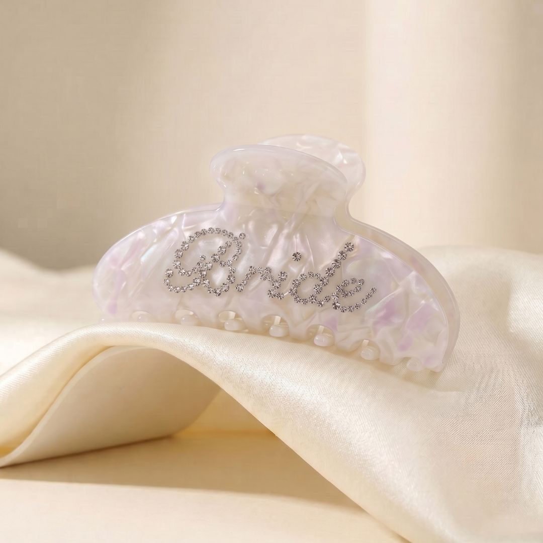 Pearl bridal claw clip with crystal Bride lettering on satin fabric